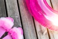 Close-up girl or woman empty glamour fashion fluffy fuzzy slippers and inflatable float ring on wooden floor background Royalty Free Stock Photo