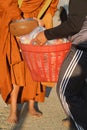 Close up : Give rice food in alms to a Buddhist