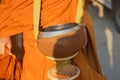 Close up : Give rice food in alms to a Buddhist monk. Royalty Free Stock Photo