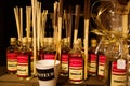 Close up of glass bottles with perfume scent of vanilla and fragrance Perfusor sticks in shelf inside French shop