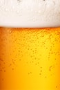 Close-up glass of cold beer with foam as texture and background, post-processed, generative ai Royalty Free Stock Photo