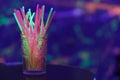 Colorful light sticks on bar table
