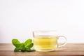 Close up a glass cup of mint tea with green fresh peppermint lea Royalty Free Stock Photo