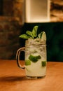a close up of a glass of drink with lime and mint Royalty Free Stock Photo