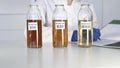 Glass flasks with biodiesel B10, B30, B100 undergo chemical tests in the laboratory
