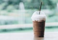 Close up glass of ice chocolate on wood table, selective focus Royalty Free Stock Photo