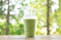 Close up glass of ice matcha green tea on wood table, selective focus Royalty Free Stock Photo