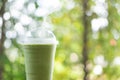 Close up glass of ice matcha green tea on wood table, selective focus Royalty Free Stock Photo