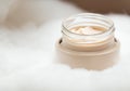 Close up Glass jar with beige cream