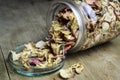 a glass jar of dried yellow and pink rose petals Royalty Free Stock Photo