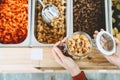 Woman buying bulk foods in plastic free grocery store