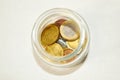 a glass jar with pennies