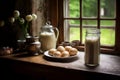 Close up of a glass of milk and three potatoes on a light wooden table