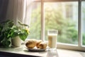 Close up of a glass of milk and three potatoes on a light wooden table