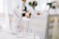 Close up of glass and name card. Table setting at wedding. Card for the name of the guest at engagement party Royalty Free Stock Photo