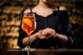 Close-up glass of ready-made negroni cocktail stands at the bar. Royalty Free Stock Photo