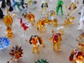 Close up glass souvenir figurines of dogs in a local bazaar