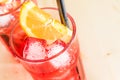 Close-up of glass of spritz aperitif aperol cocktail with orange slices and ice cubes