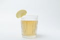 Close up of glass of tasty apple juice with slice of apple on the white background