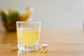 Close up glass with water and sparkling pill. Magnesium anti-stress, painkiller or orange drink Royalty Free Stock Photo