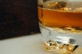 A close-up of a glass of wiskey isolated on a white background