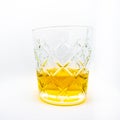 A close-up of a glass of wiskey isolated on a white background