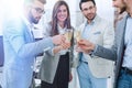 Close up.glasses of champagne in the hands of the business team. Royalty Free Stock Photo