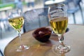 Glass of beer and glass of white wine on a table Royalty Free Stock Photo