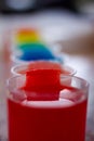 Close-Up Of Glasses Full Of Coloured Liquid