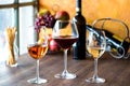 Glasses of rose, red and white wine on a wooden table. Royalty Free Stock Photo