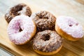 Close up of glazed donuts pile on table