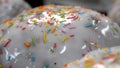 Close-up of glazed easter cakes. Stock footage. Traditional easter cakes covered with white sugar glaze and decorated