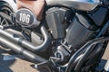 Close-up of a gleaming Harley Davidson motorcycle engine with chrome and metallic components, lit by ambient light casting shadows Royalty Free Stock Photo