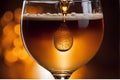 Close-up of a glistening droplet sliding down the side of a chilled amber-tinted craft beer glass