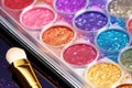 close-up of glittery face paint palette and brushes