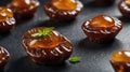Delicious Caramel Date Cakes with Mint Garnish on Dark Background Royalty Free Stock Photo