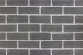 Close-up of glossy smooth grey brick wall. Background for interior and exterior design with horizontal pattern. Royalty Free Stock Photo