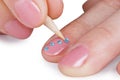 Close up - gluing paste on nails Royalty Free Stock Photo