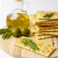 Close up of gluten free crackers with rosemary, olives and olive oil