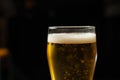 Close-up of goblets with pouring beer Royalty Free Stock Photo