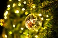 Close Up gold balls of Christmas tree decorations on abstract light golden bokeh background. Royalty Free Stock Photo