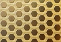 Gilded metal texture background. Hexagonal embossed pattern.