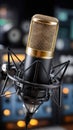 Close-up of a gold condenser microphone in recording studio for vocal and broadcast work Royalty Free Stock Photo