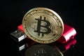 Close up gold digital cruptocurrency coin bitcoin with hardware