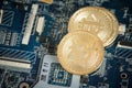 Close Up Gold Digital Cryptocurrency Coin on Computer Motherboard. Bitcoin Mining Concept. Crypto Currency Background. Royalty Free Stock Photo