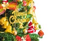 Close up gold merry chirstmas word and ornaments on christmas tree isolat