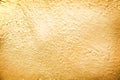 Gold paint on concrete wall abstract texture in rough seamless patterns for background Royalty Free Stock Photo