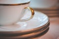Close up of Gold Rimmed Tea Cup and Saucers
