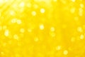 Gold yellow or light orange blurred bokeh sparkle glitter for Christmas festival or Happy new year color background Royalty Free Stock Photo