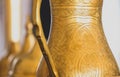 Close-up of golden arabic brass coffee pot. Royalty Free Stock Photo